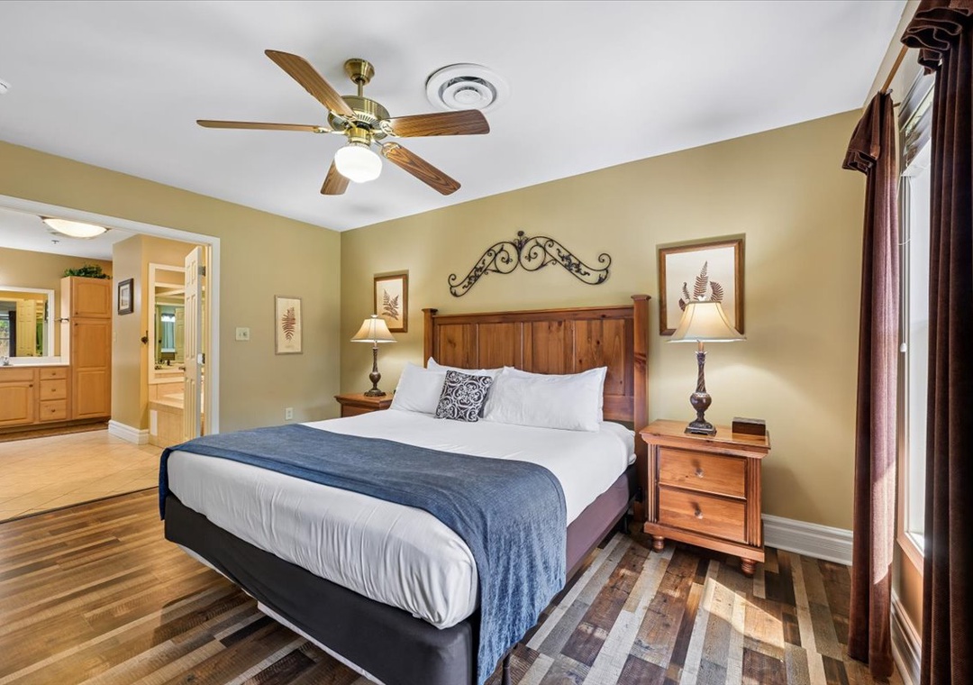 Unwind in your cozy bedroom featuring rustic wood furnishings, soft lighting, and a plush bed perfect for peaceful nights.
