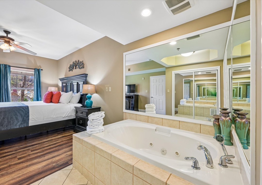 Unwind in your spacious suite featuring a luxurious jetted tub and comfortable king bed, perfect for romantic evenings.