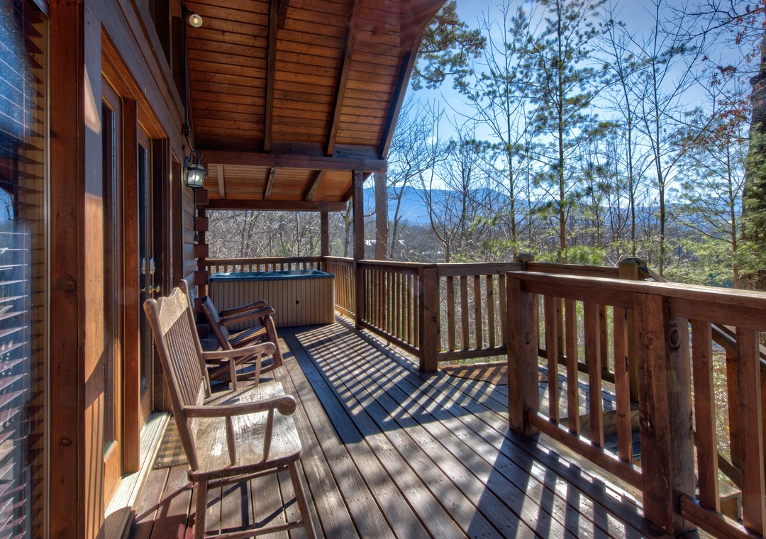 Sip your morning coffee on this peaceful wraparound deck, where mountain views and gentle rocking chair moments create pure serenity.
