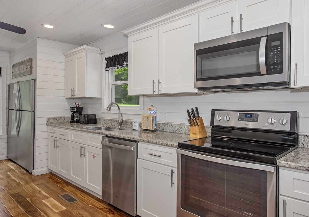 Your fully equipped kitchen offers everything you need to prepare meals with ease, featuring modern stainless steel appliances, ample counter space, and a bright, welcoming atmosphere perfect for your getaway.