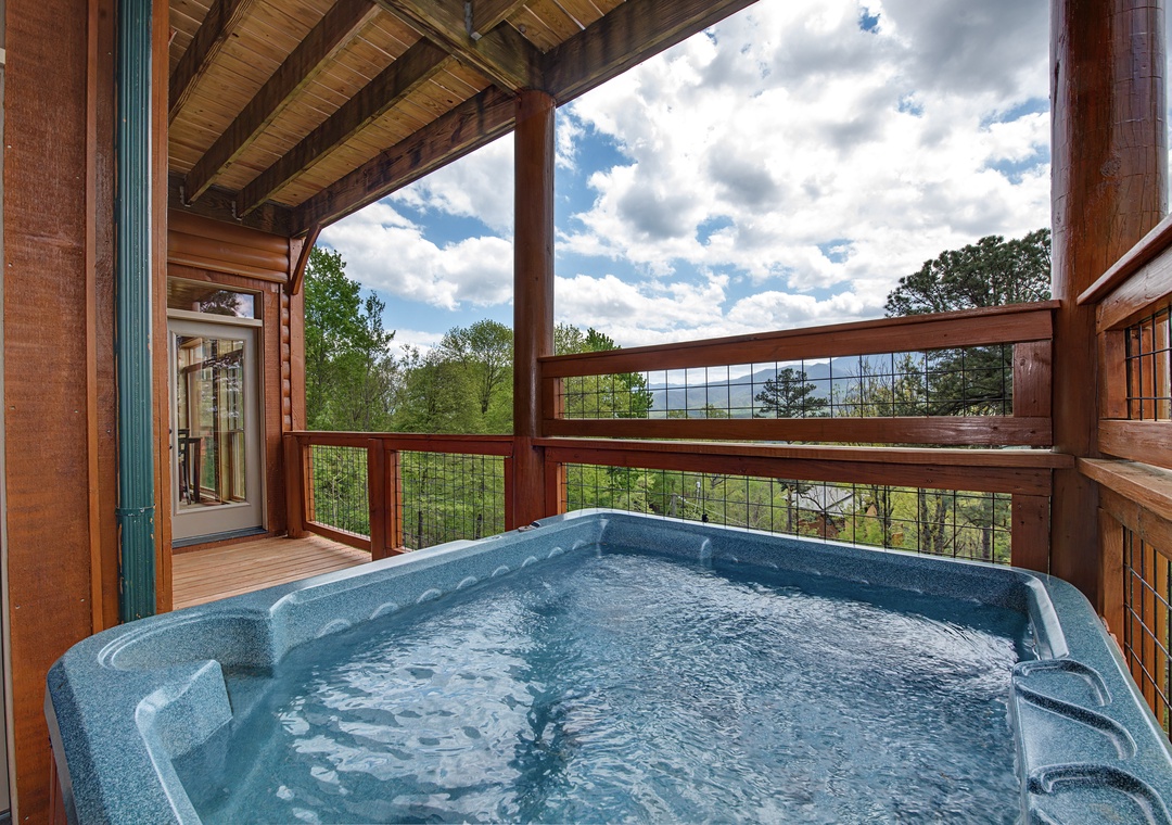 Soak in your private hot tub on this covered deck, where mountain vistas and forest views create the perfect backdrop for relaxation.