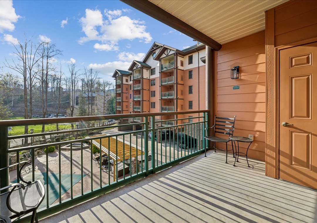 Step onto your private balcony and breathe in the fresh mountain air while enjoying views of the resort's pool and neighboring lodges.