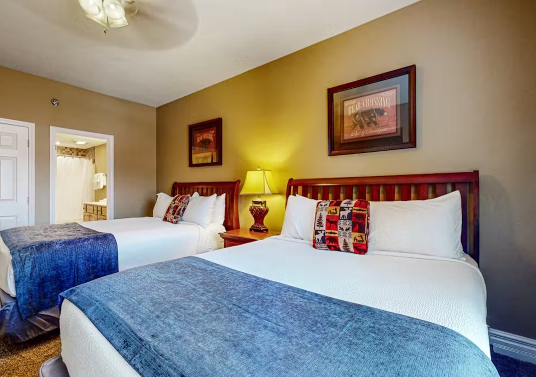 Rest easy in your cozy twin bed setup with crisp linens and rustic charm that makes every stay memorable.