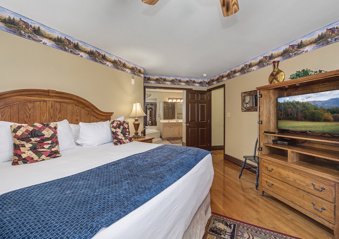 Rest in your cozy king-size bed surrounded by rustic wood furnishings and quilted charm—mountain views await from your entertainment center.