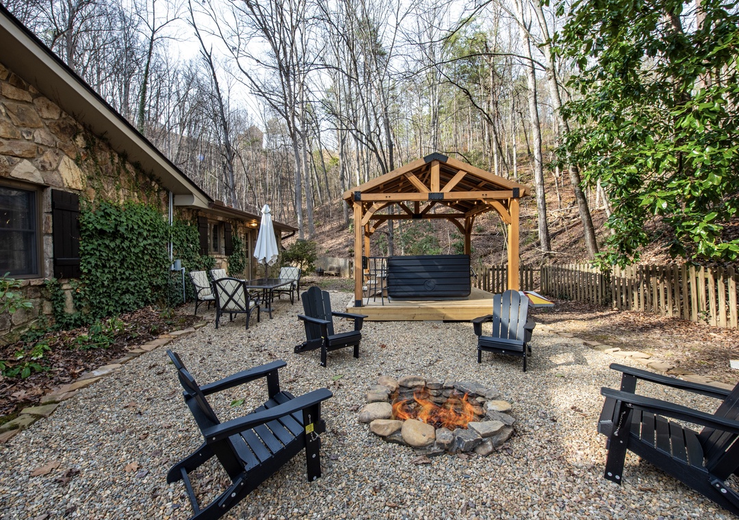 Gather around your private fire pit for cozy evenings under the stars, with comfortable seating and a charming gazebo.