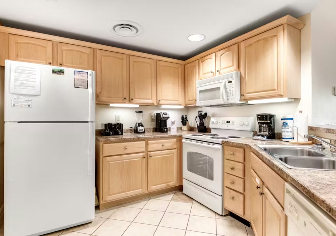Your fully equipped kitchen awaits with granite counters, quality appliances, and everything needed to prepare meals during your stay.