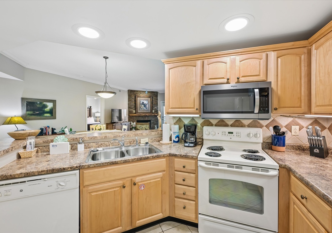 Your fully-equipped kitchen features granite countertops, wood cabinetry, and all appliances needed for cooking memorable meals during your stay.
