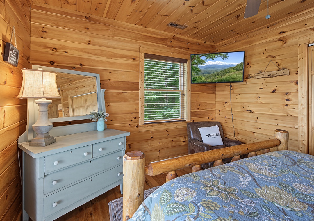 Sink into the handcrafted log bed and wake up to mountain views framed by your window, where rustic charm meets cozy comfort in your own peaceful retreat.