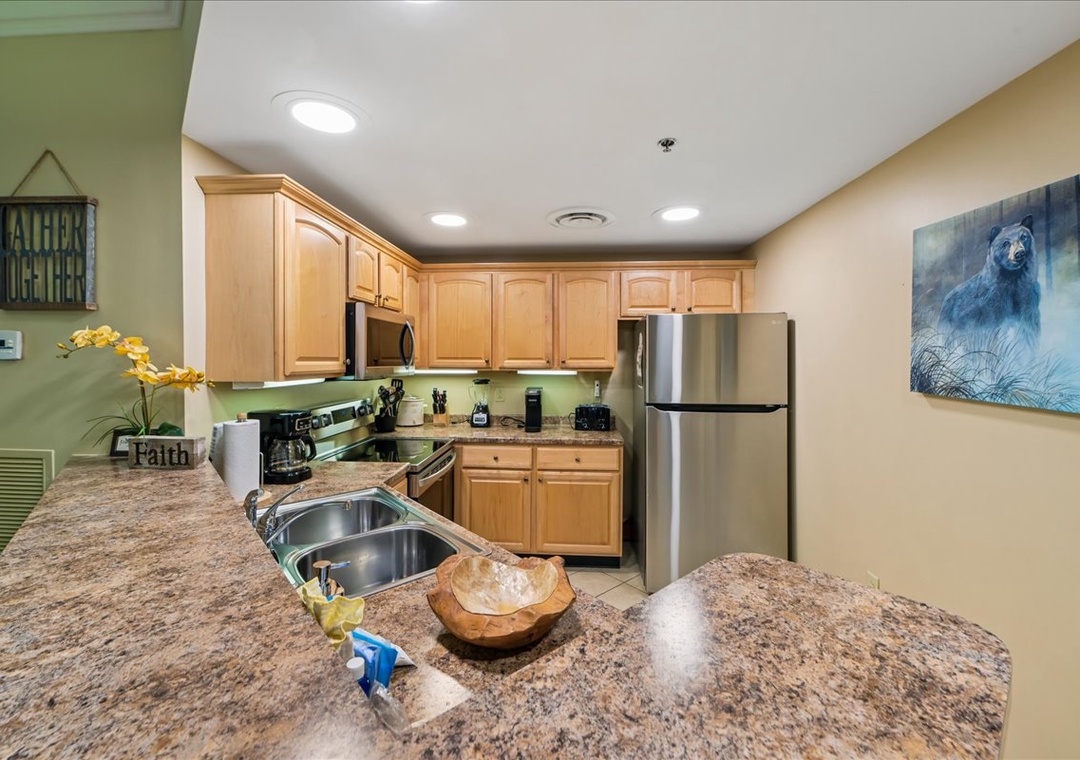 Your fully-equipped kitchen features granite countertops, stainless steel appliances, and everything you need to create memorable meals during your stay.