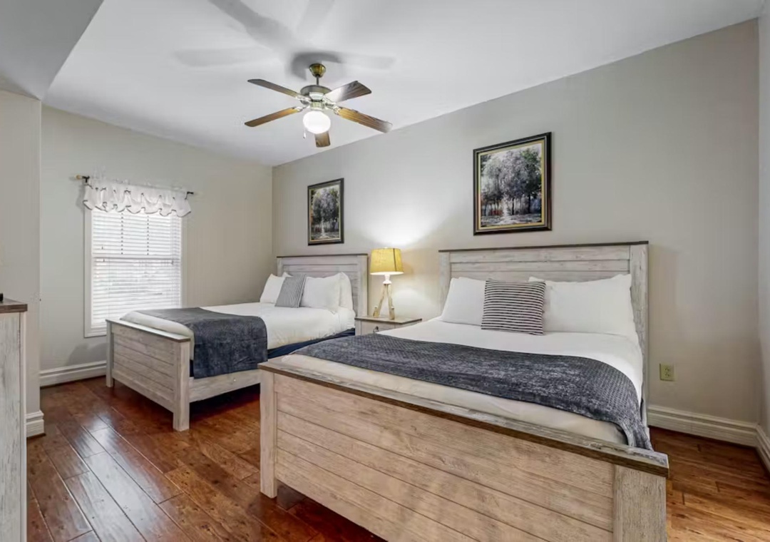 Drift off to sleep in your comfortable twin beds with soft linens and peaceful artwork adorning the walls.