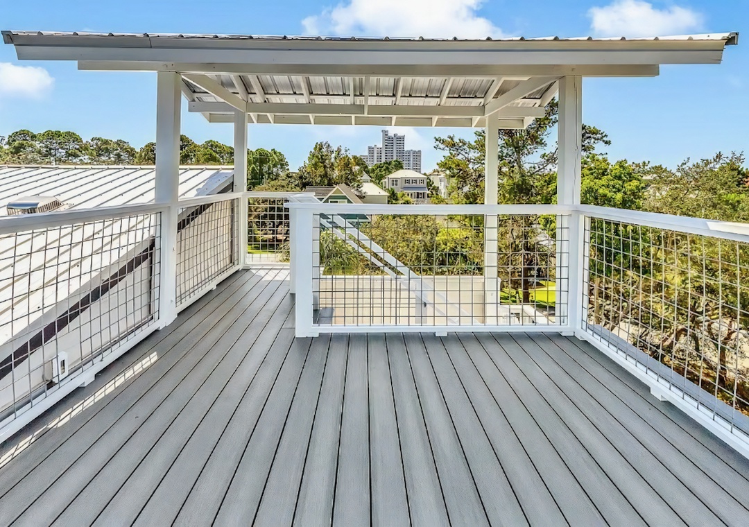A quiet observation deck where treetops, open sky, and fresh air set the scene.