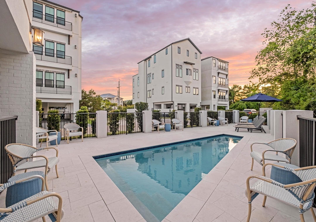 Sunlit afternoons unfold beside your private pool, where lounge chairs invite long moments of relaxation.