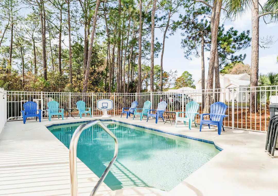 Serene poolside moments framed by towering pines.