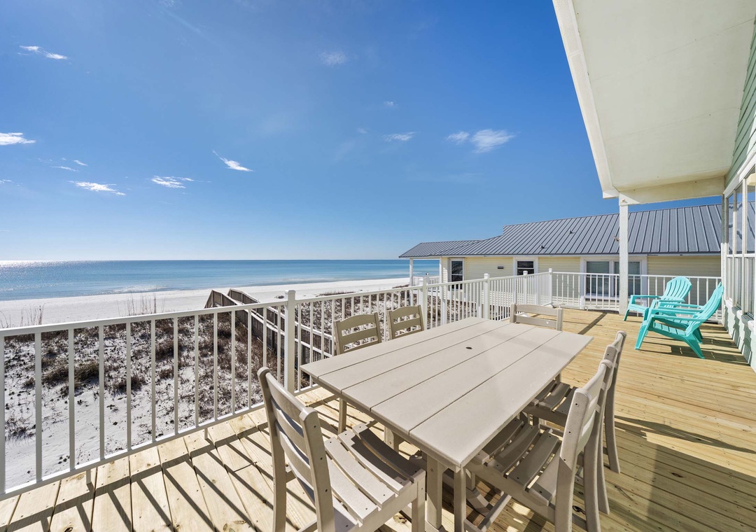 Dine al fresco on the beachfront balcony