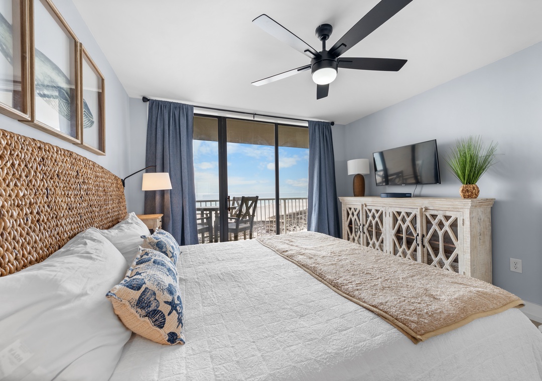 Primary bedroom with balcony access