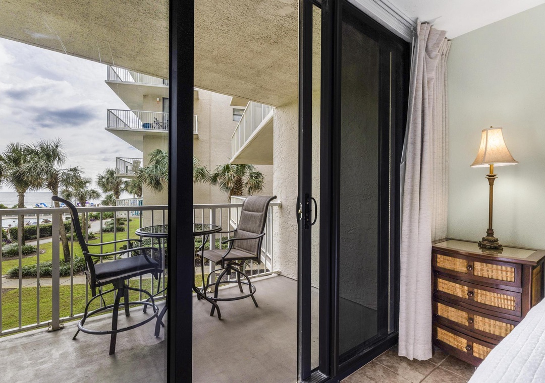 Primary bedroom with balcony access