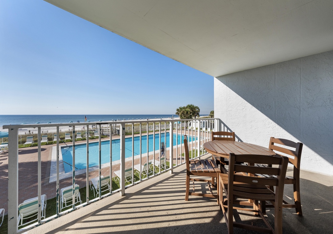 Balcony dining with pool views