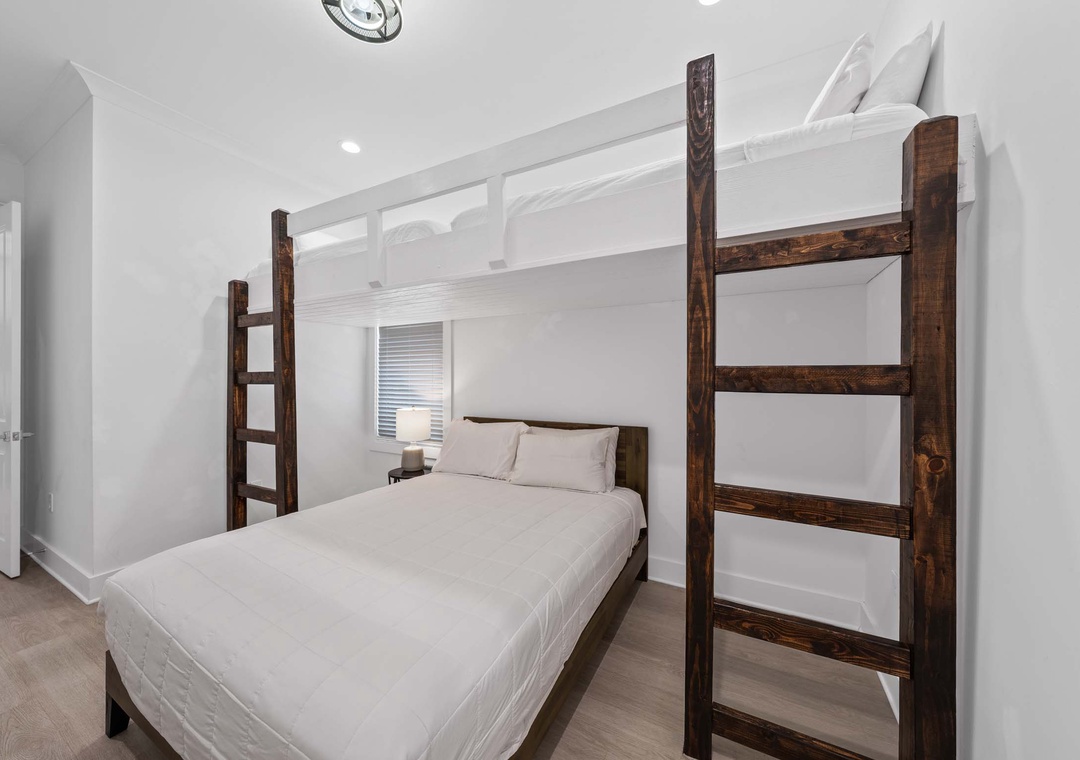 Guest bedroom 3 with queen bed and two twin loft beds