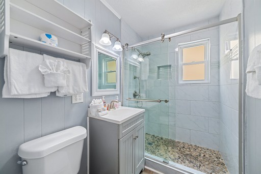 Full bathroom with tiled walk-in shower