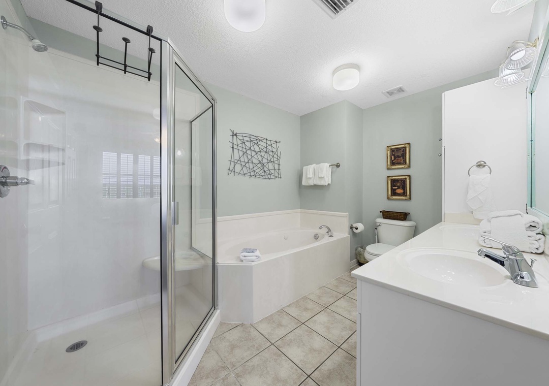 Soaking tub and walk-in shower in the primary bathroom