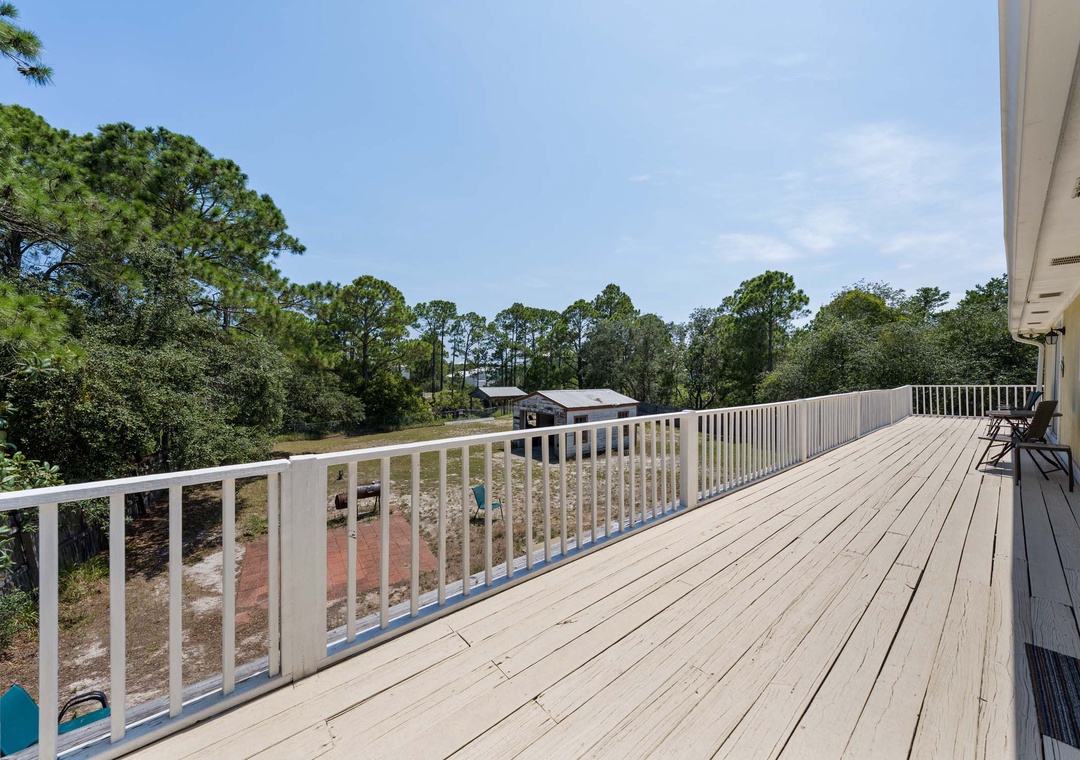 Second floor deck overlooking the backyard