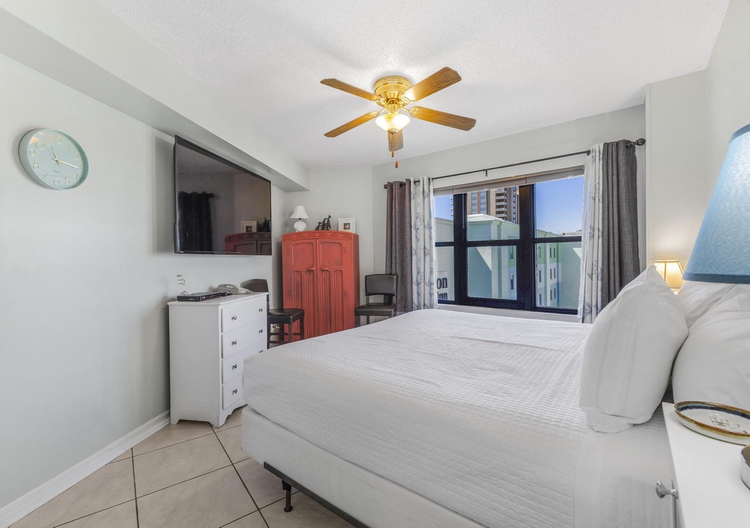 King bedroom with large flat-screen TV