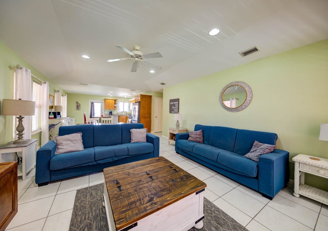 Living space featuring two futon sleepers.