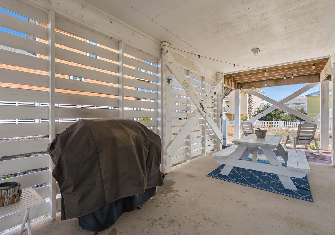 Propane grill under the house