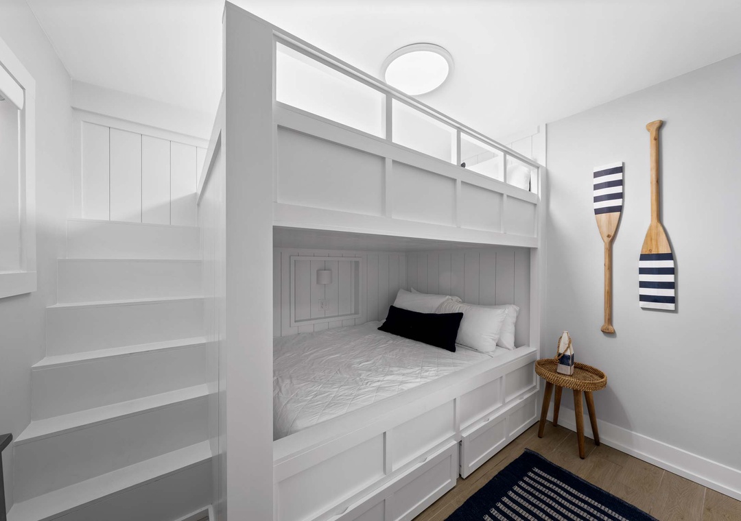 Guest bedroom with queen-over-queen bunk beds