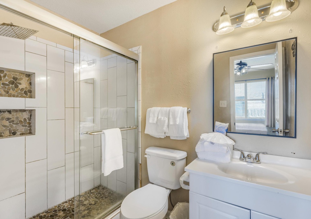 Primary bathroom with an updated walk-in shower