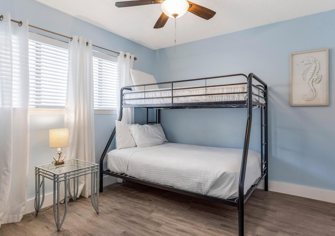 Guest bedroom with twin-over-double bunk bed