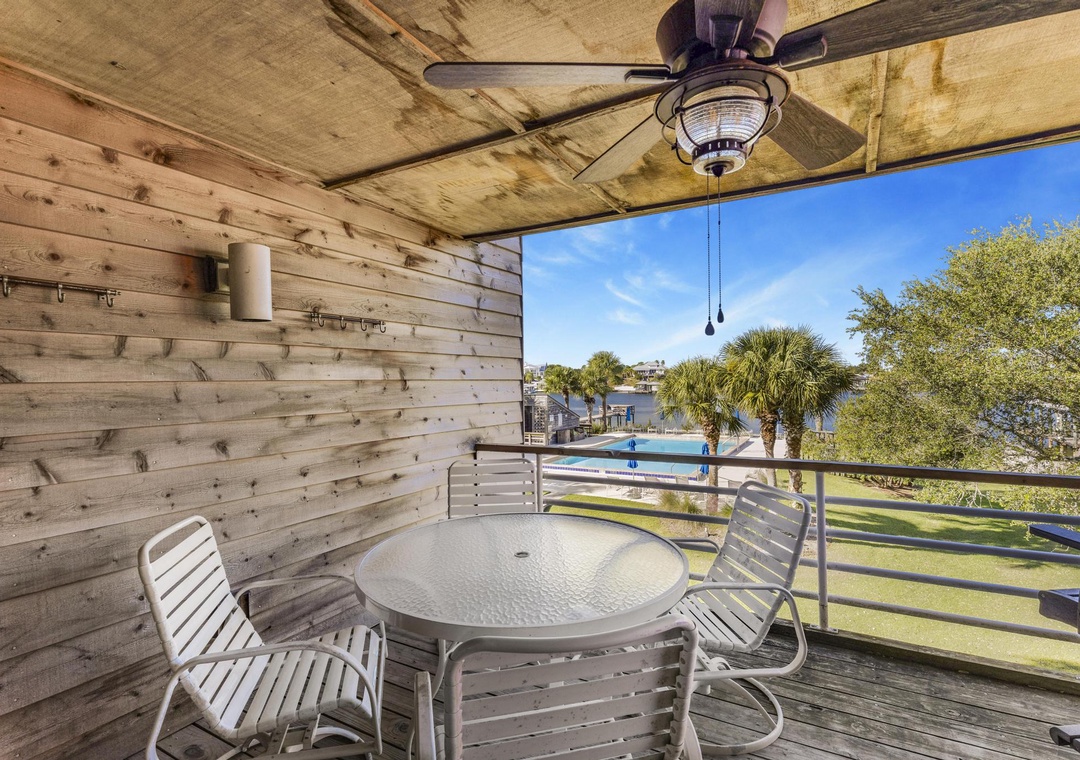 Dine al fresco with river and pool views