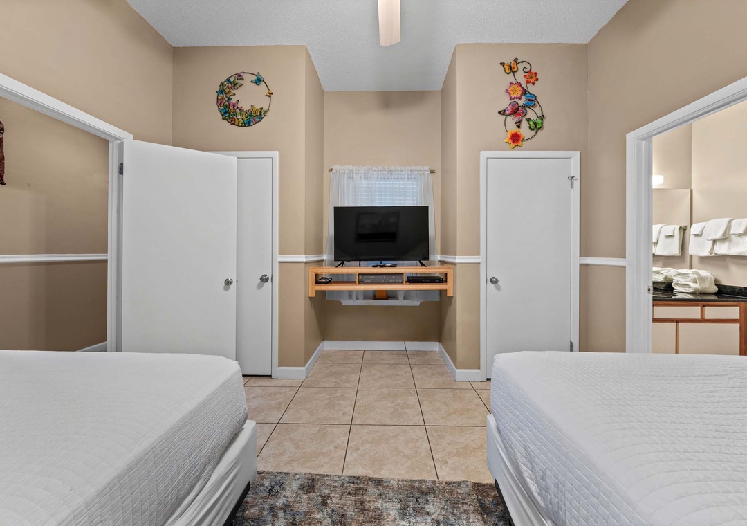 Guest bedroom with two full beds