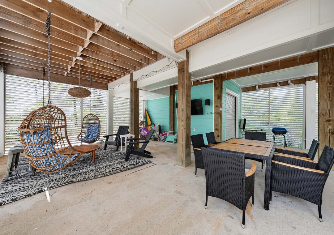 Ground floor patio with dining table and lounge area
