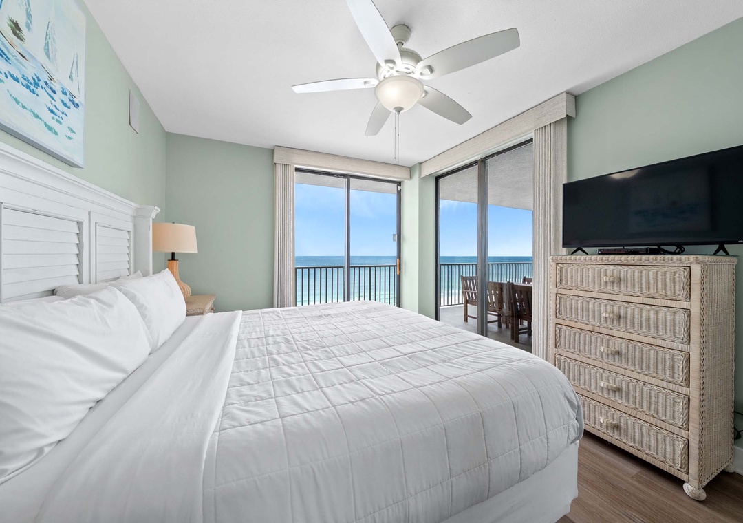 Primary bedroom with balcony access