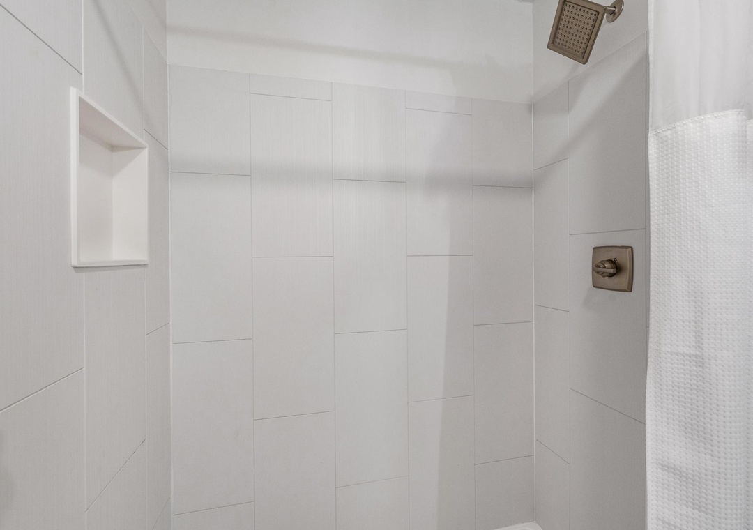 Walk-in shower in the full bathroom