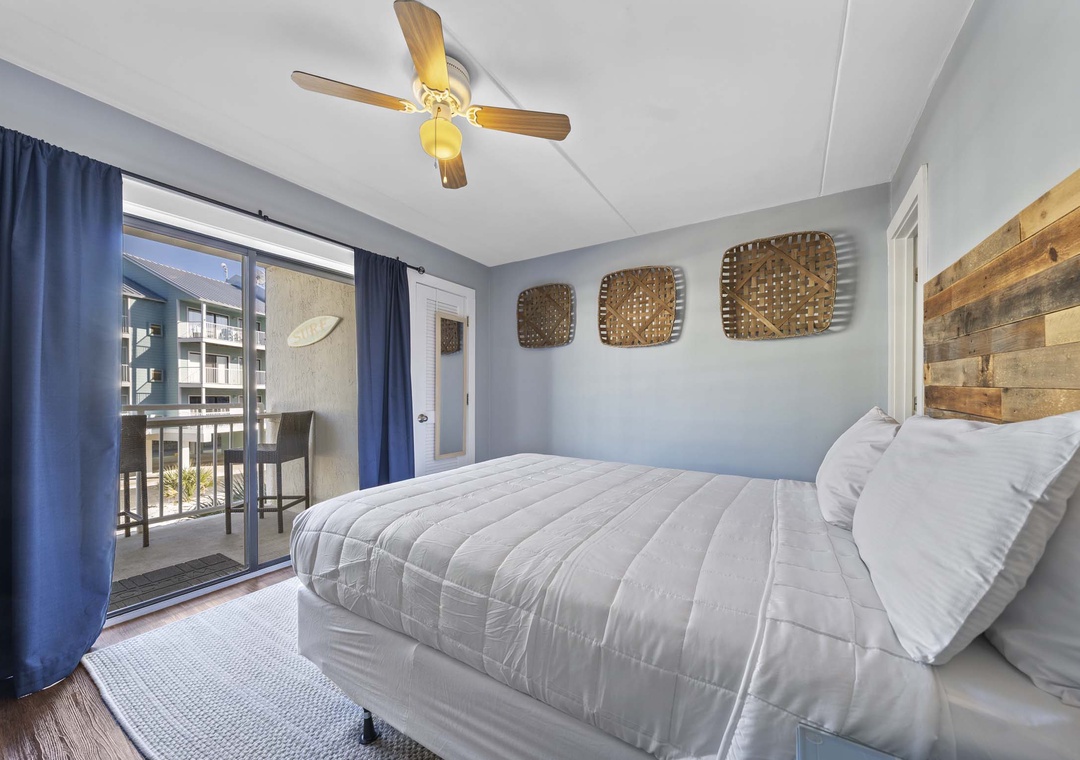 Primary bedroom with balcony access