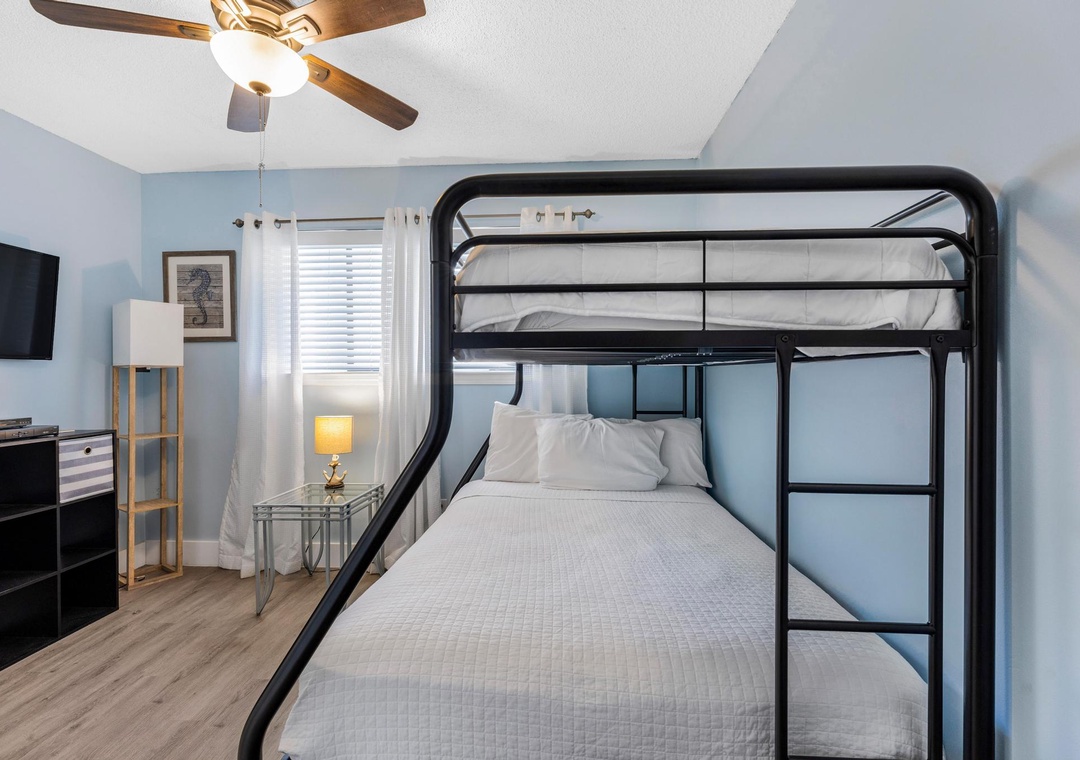 Guest bedroom with bunk bed and TV