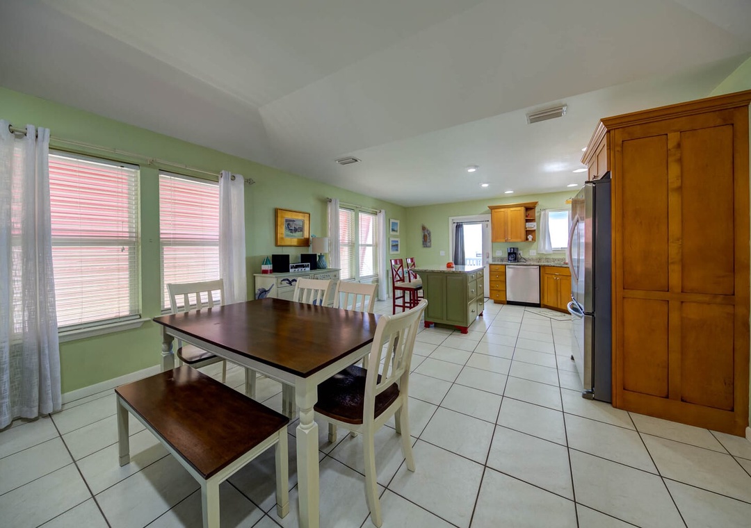 Dining area with seating for six at table.