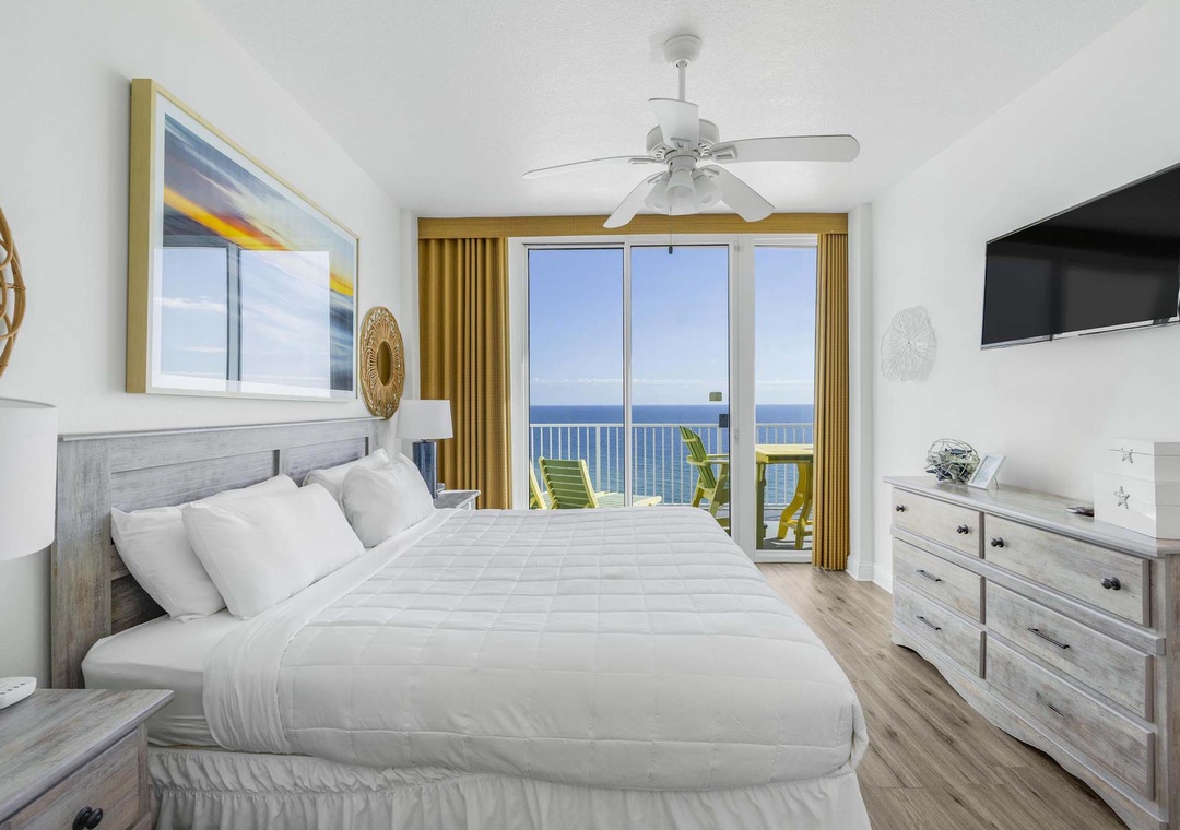 Primary bedroom with balcony access