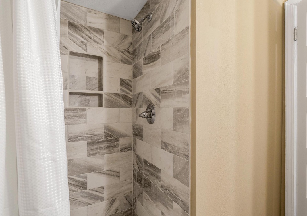 Full tiled walk-in shower in the primary bathroom