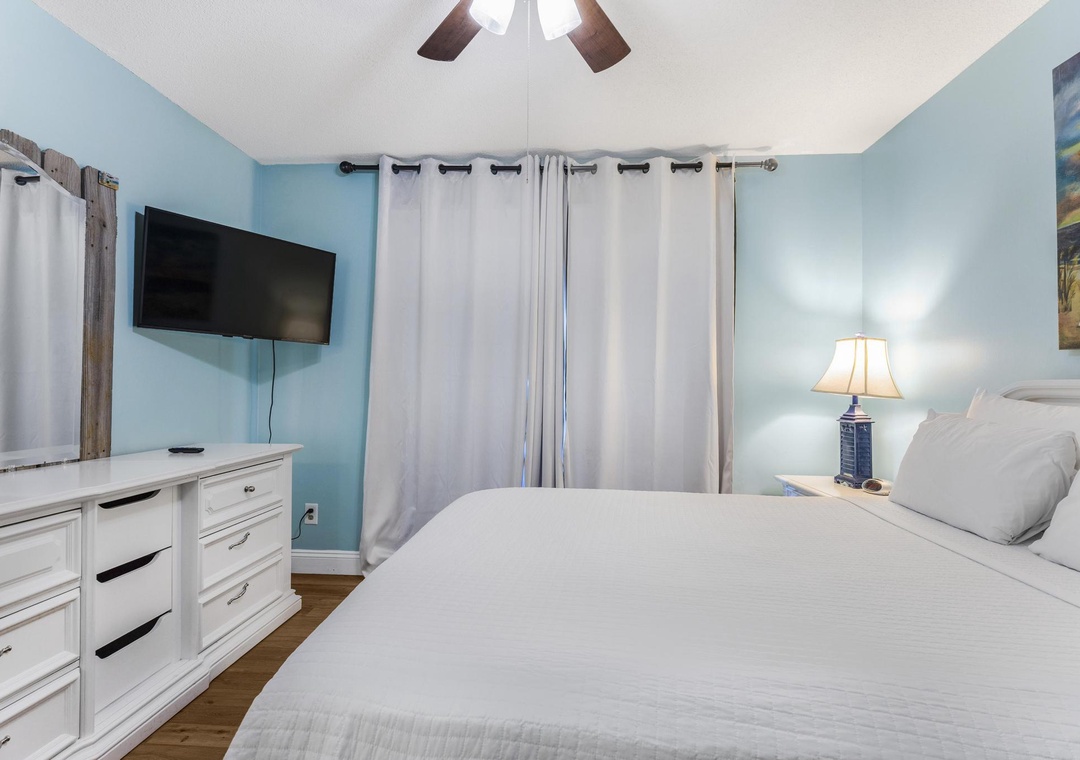 Guest bedroom with wall-mounted TV