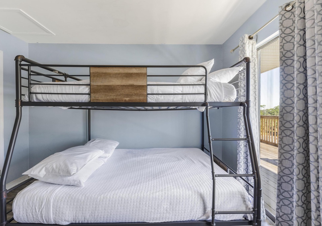 Bunk room with balcony access