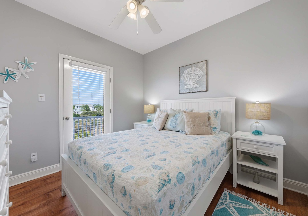 Top floor guest bedroom with queen bed