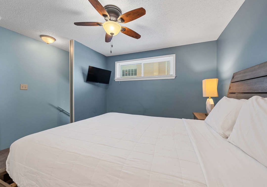 Queen bed in the upstairs bedroom