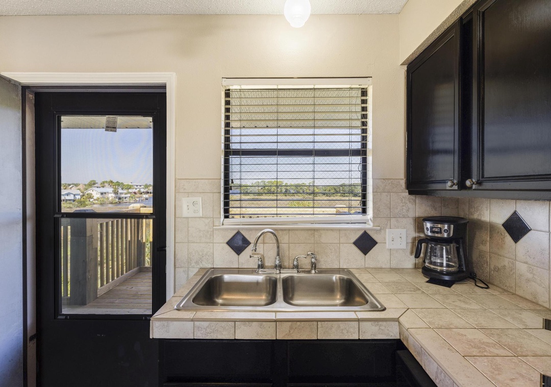 Kitchen sink with a view out the window