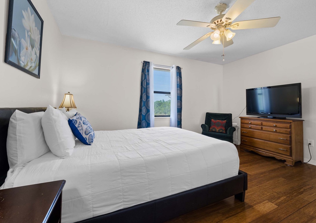 Second floor guest bedroom 1 with queen bed