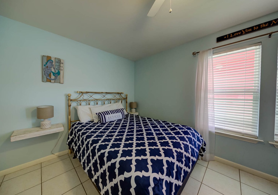 Second bedroom featuring queen-size bed.