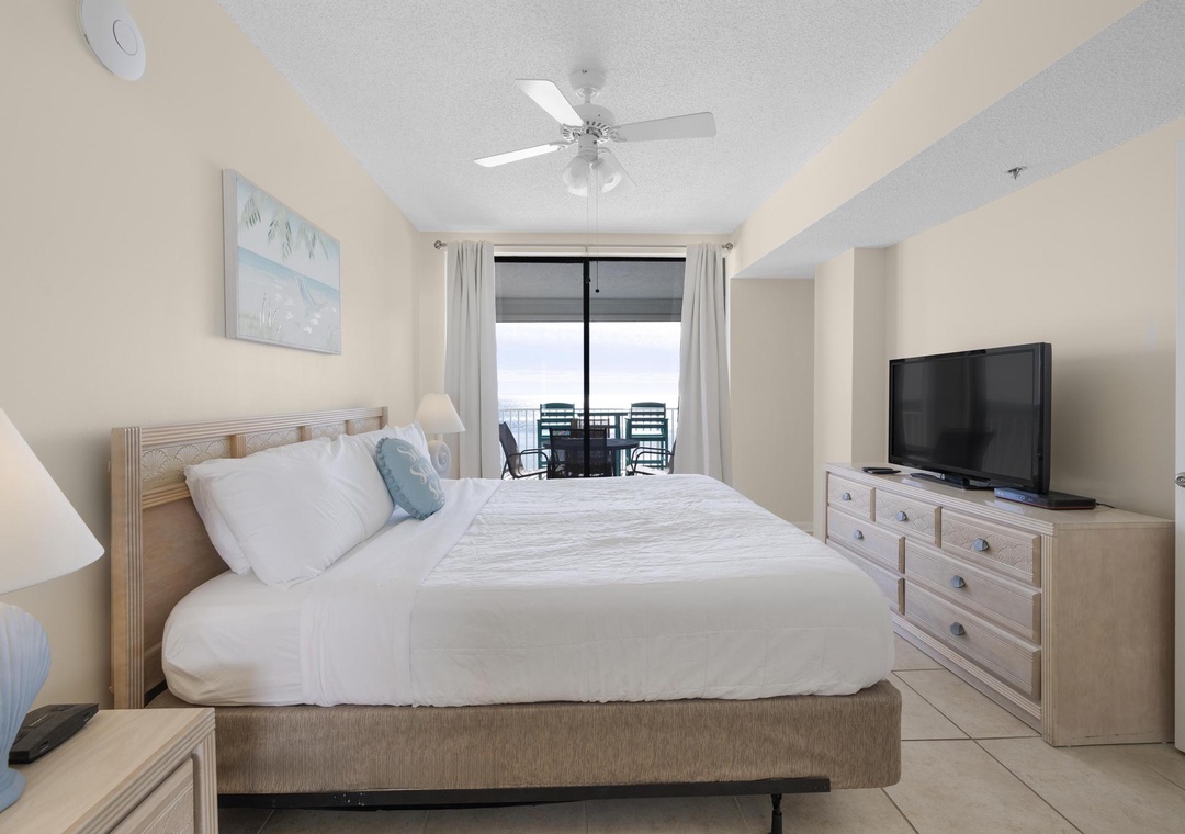 Primary bedroom with balcony access
