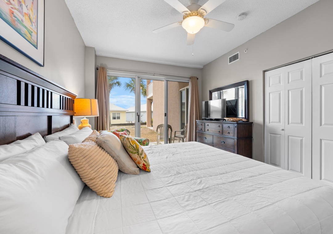 King primary bedroom with private patio
